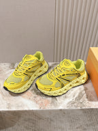 Dior unisex low-top sneakers in bright yellow, angled view showing tread sole