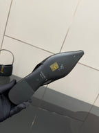 Women's black pointed-toe slingback heel insole with printed logo and lettering
