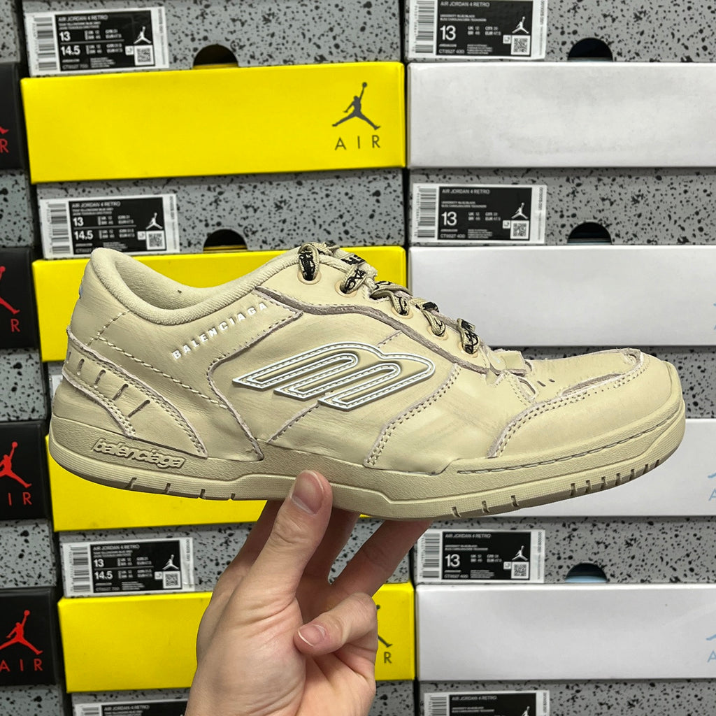 Beige Balenciaga low-top sneaker with lace-up front and stitched side logo