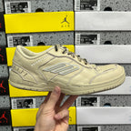 Beige Balenciaga low-top sneaker with lace-up front and stitched side logo