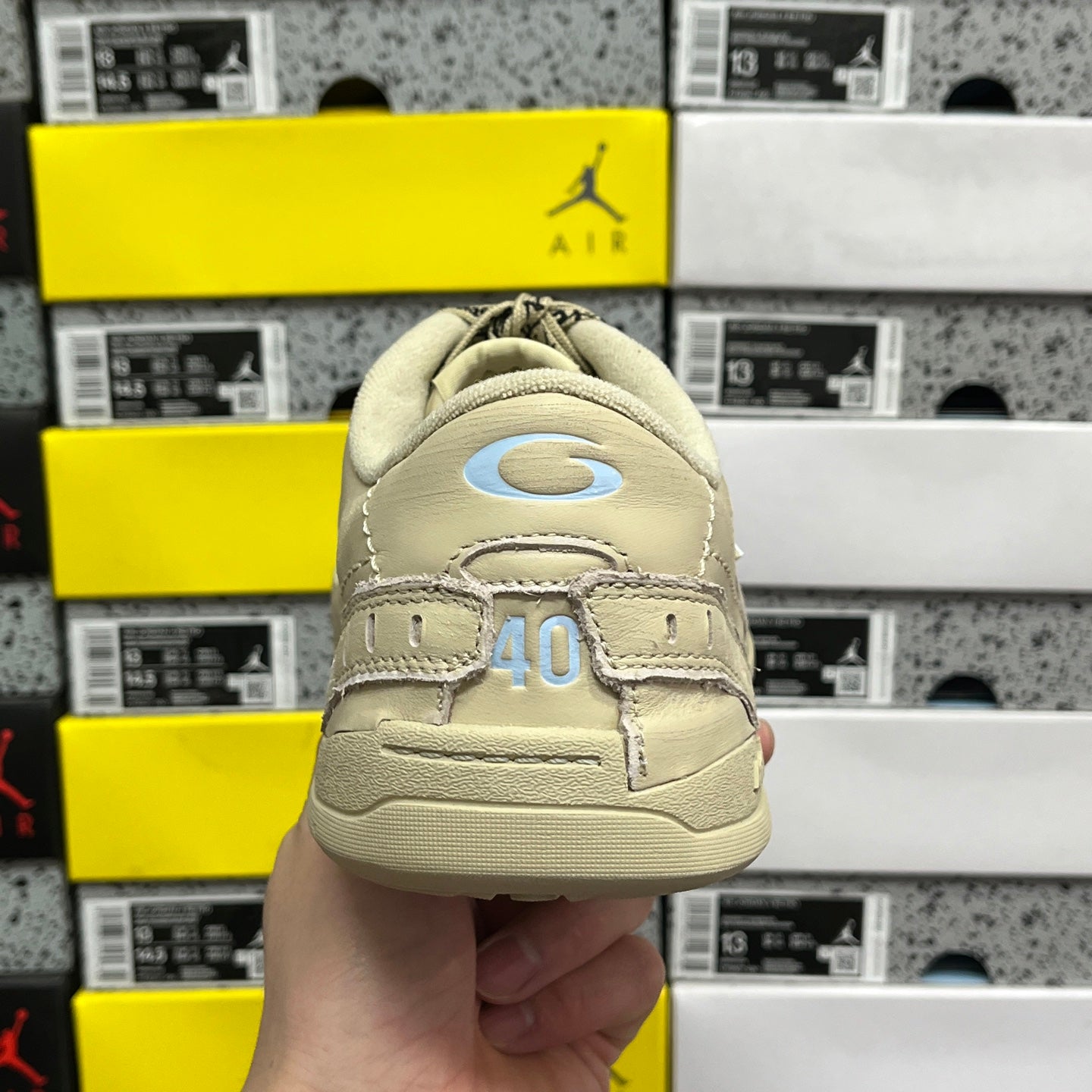 Beige Balenciaga sneaker heel with logo patch and '40' graphic