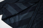 Fendi long hooded jacket fabric close-up in dark blue with diagonal stripe pattern