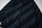 Fendi long hooded jacket front detail with dark blue diagonal stripes and central zipper
