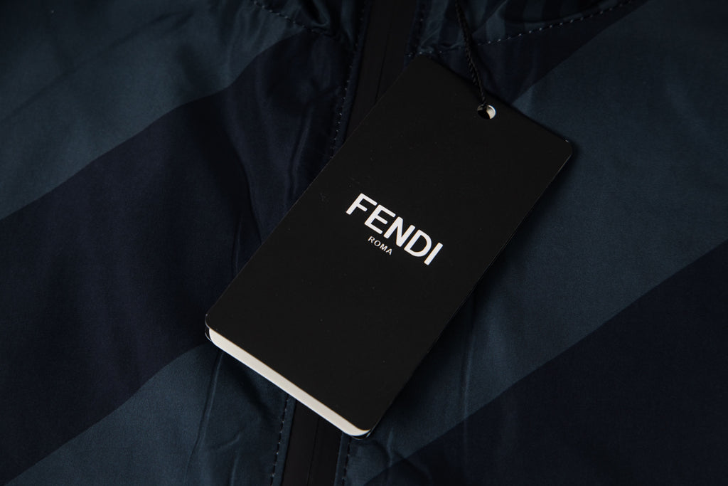 Fendi long hooded jacket with FENDI brand tag attached on dark blue fabric