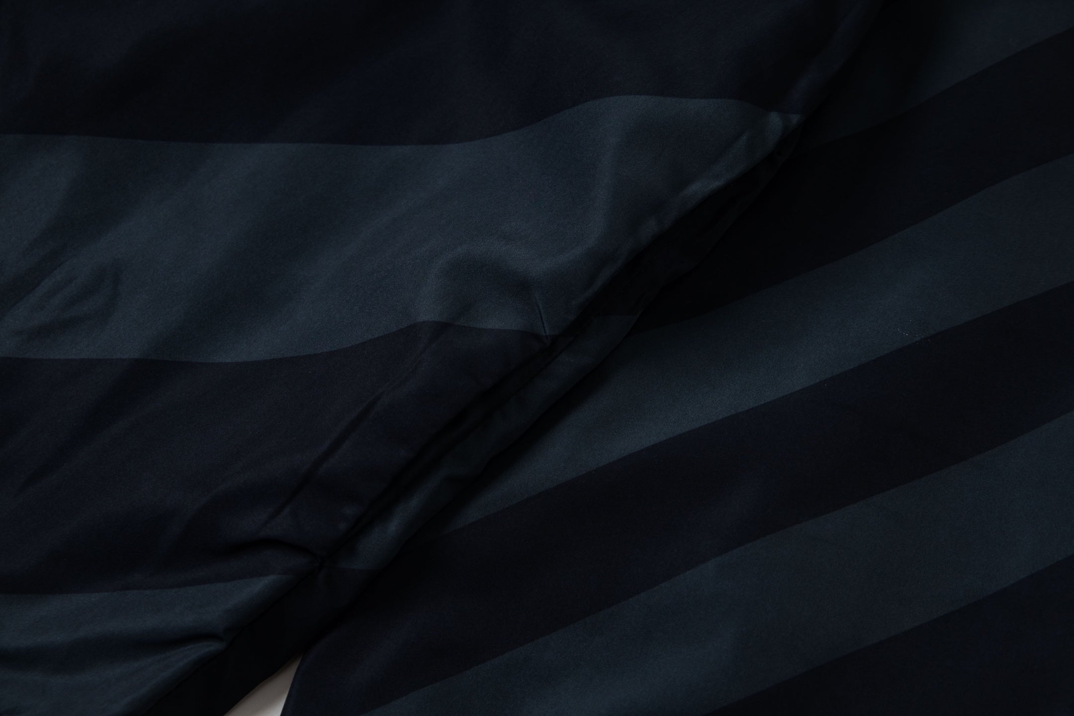 Fendi long hooded jacket close-up of dark blue diagonal stripe fabric