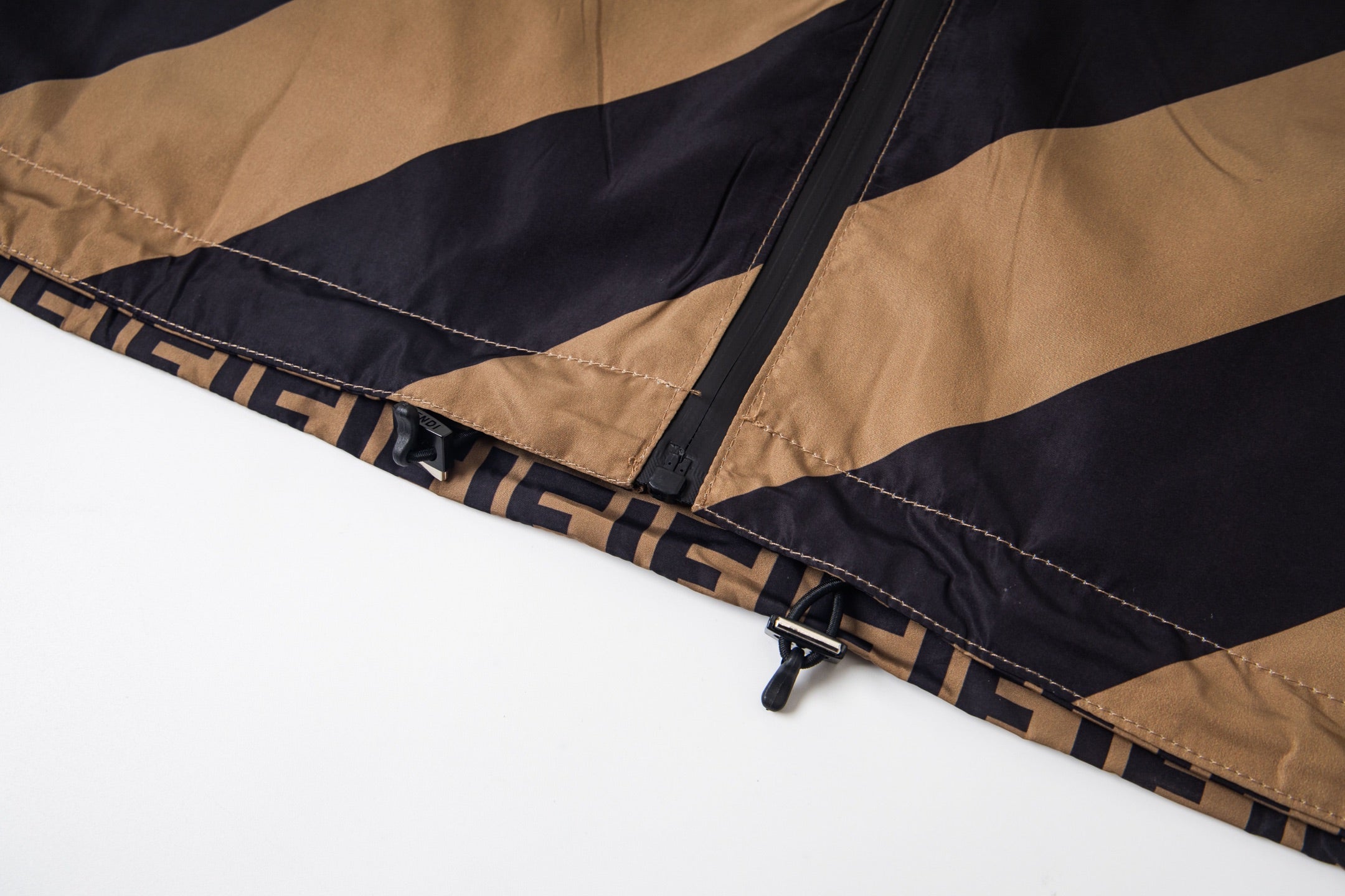 Fendi jacket hem with striped trim and black cord toggle