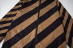 Fendi long jacket close-up of diagonal tan and navy stripes with black zipper
