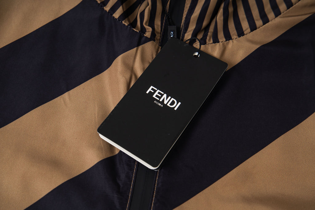 Fendi long jacket with black FENDI logo hang tag near the zipper
