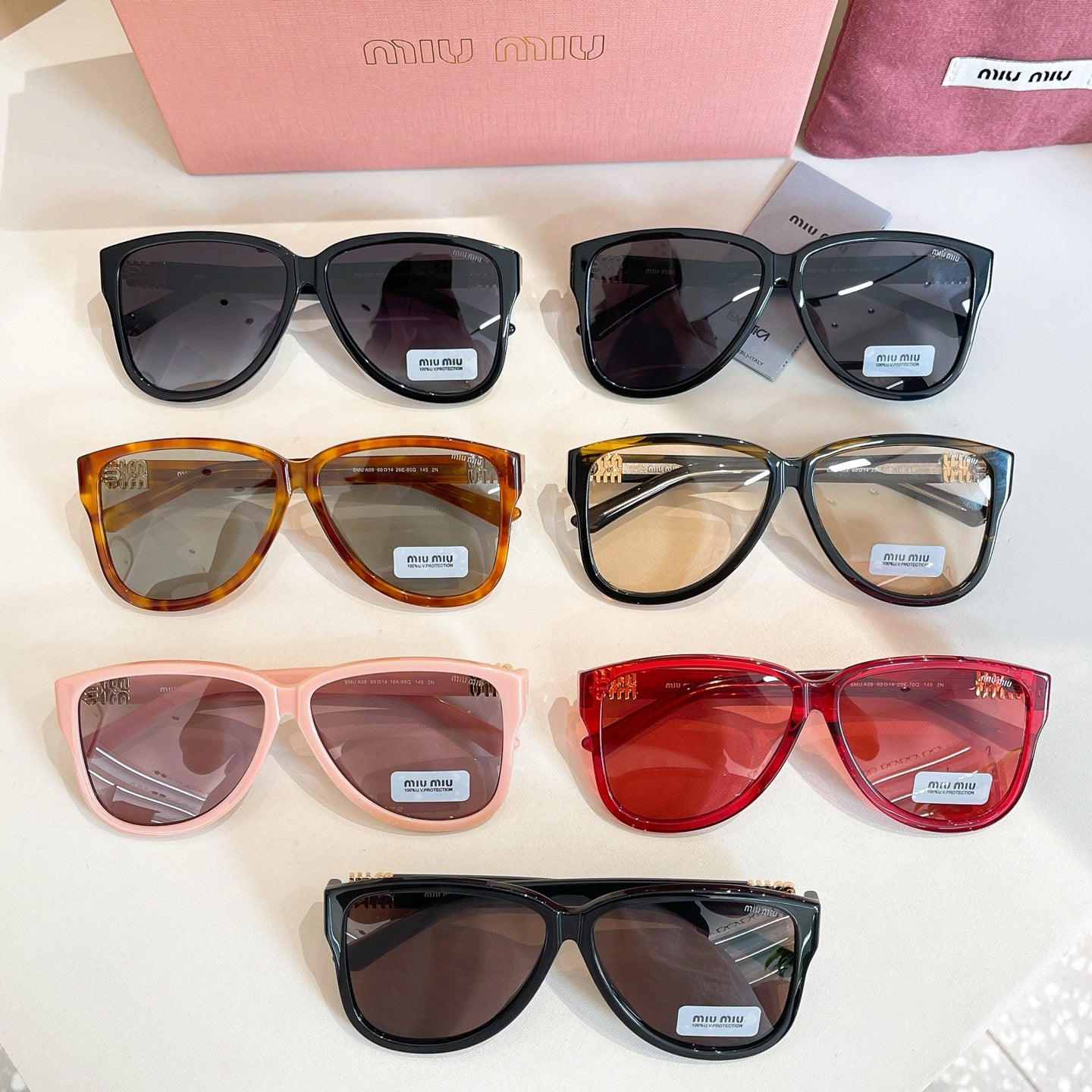 Assorted MiuMiu sunglasses with mixed frame colors and tinted lenses