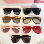 Assorted MiuMiu sunglasses in multiple frame colors with dark lenses
