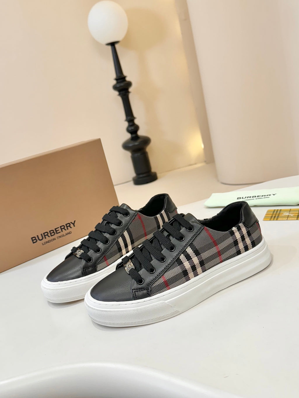 Burberry low-top sneakers, black leather with plaid side panels and black laces