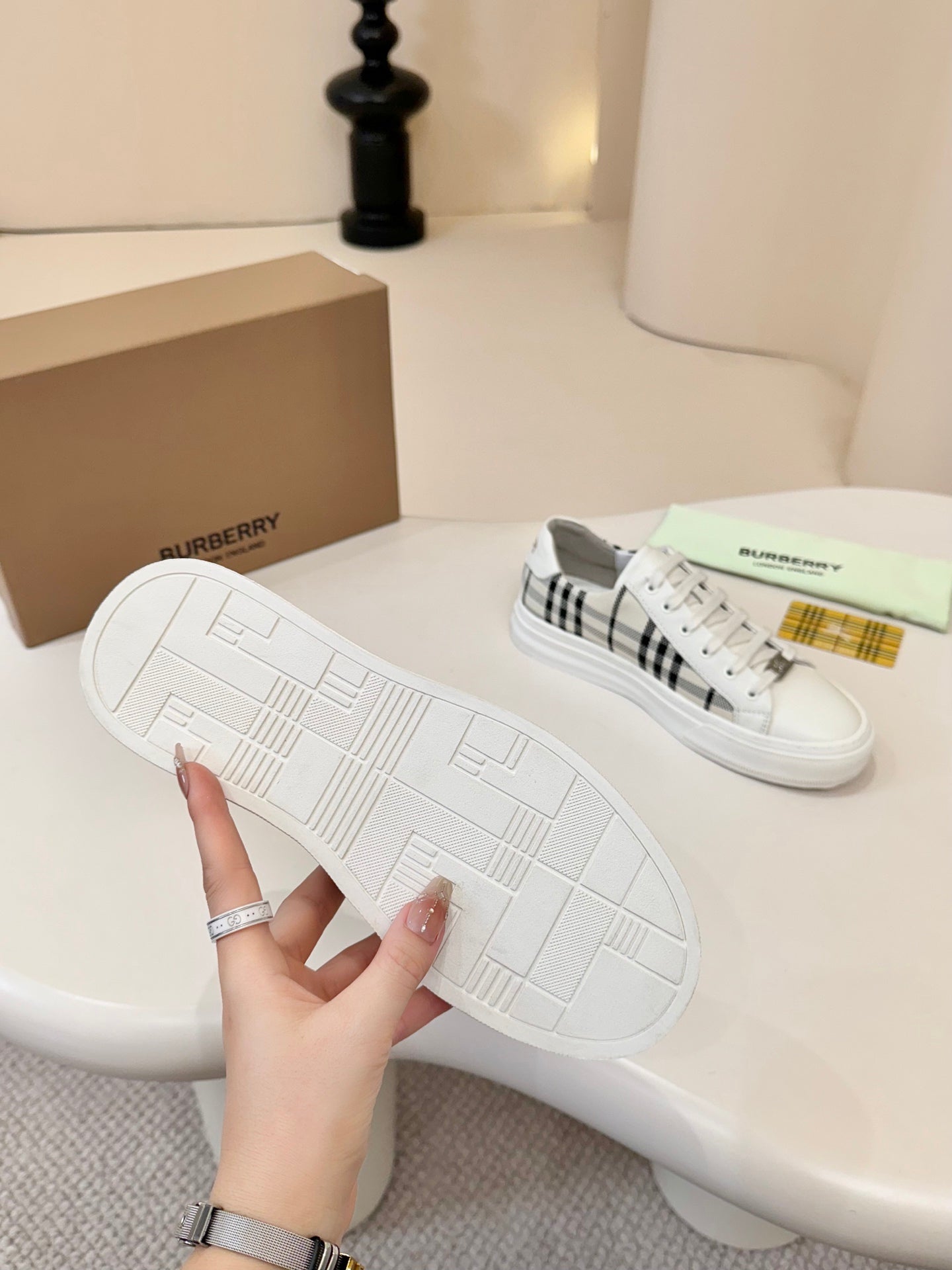 Outsole view of low-top sneakers with white rubber tread pattern