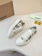 Low-top sneakers with white leather and black-and-cream check trim