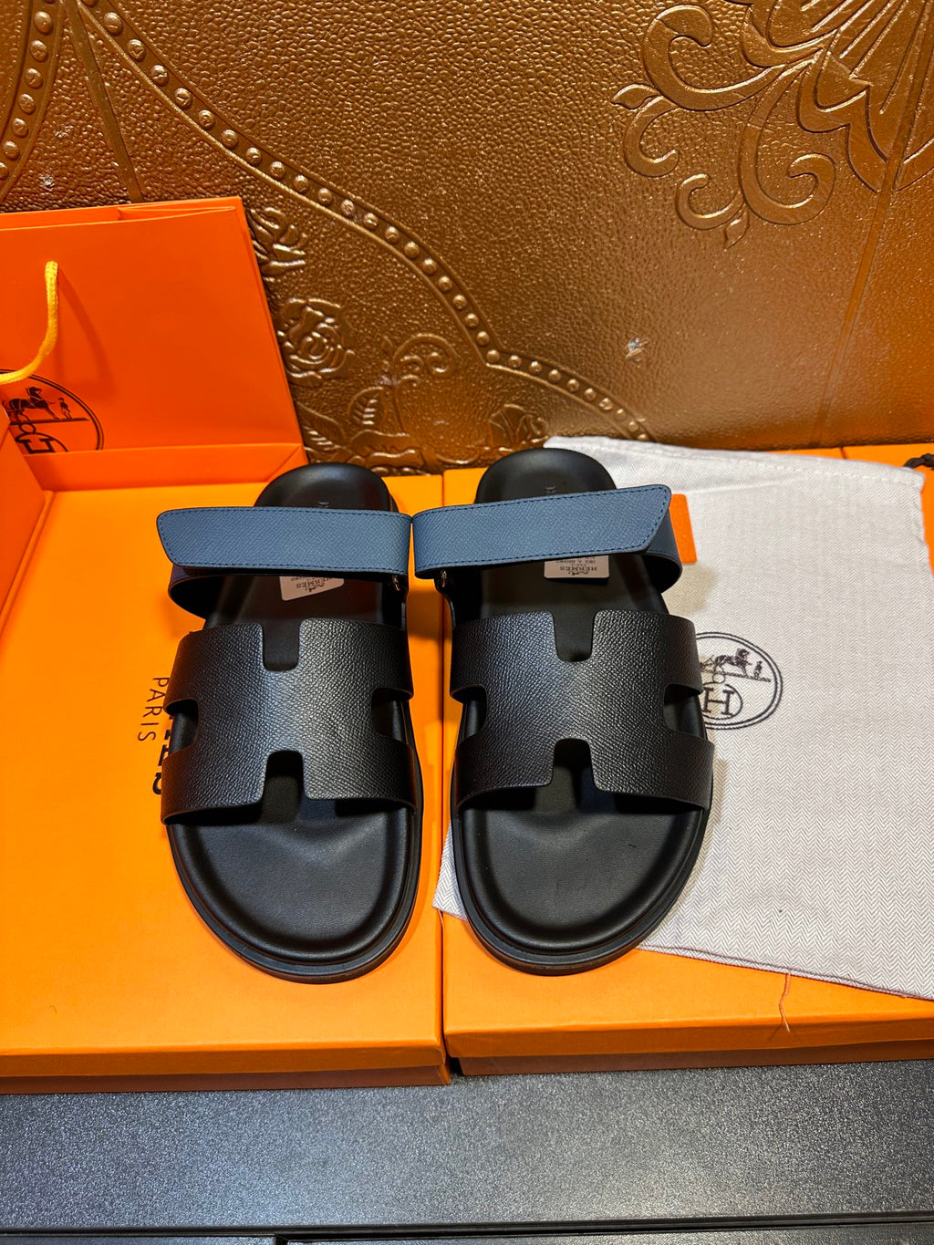 Hermes black slide sandals with blue strap, two front cutout bands