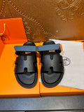 Hermes black slide sandals with blue strap, two front cutout bands