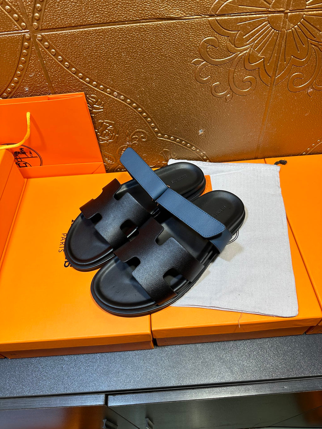 Hermes black slide sandals with blue wide strap, two front cutouts