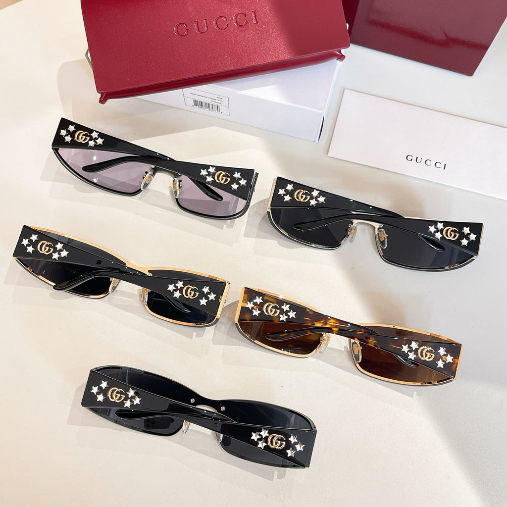 Set of black sunglasses with star and GG logo temples