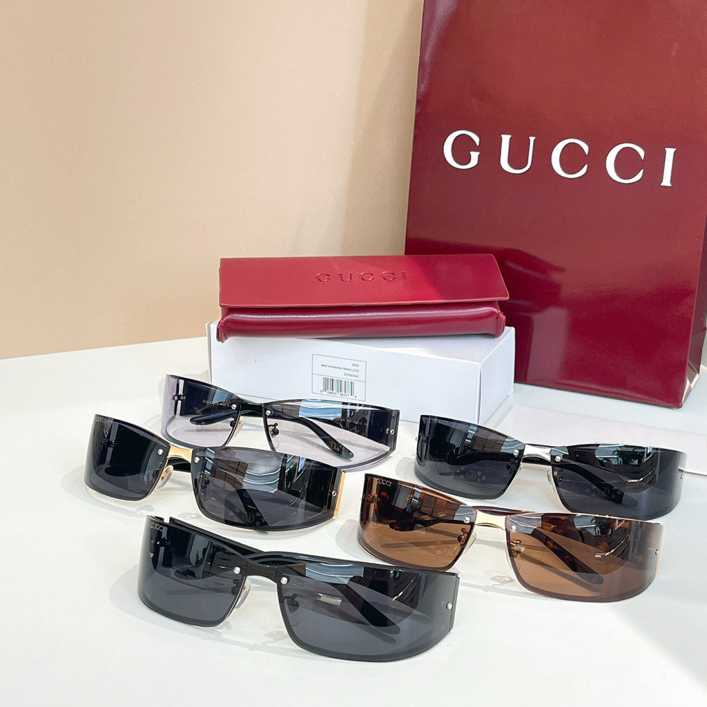 Assorted sunglasses with black frames, dark and brown lenses, logo temples