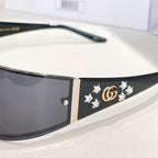 Black sunglasses with star and GG emblem on temple side