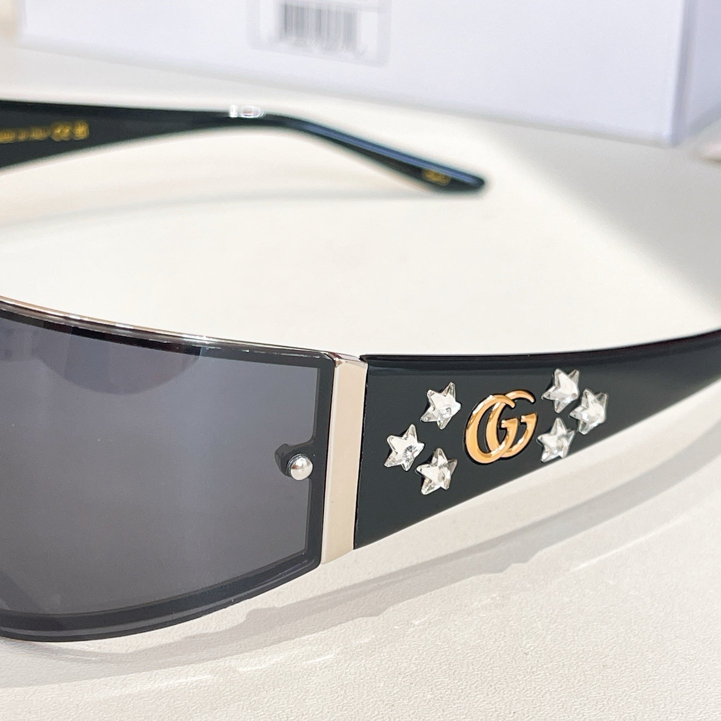Black sunglasses with star and GG emblem on temple side
