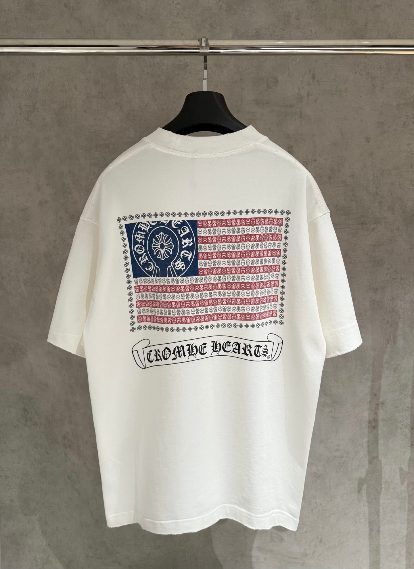 White short-sleeve T-shirt with back patriotic graphic and “Chrome Hearts” text