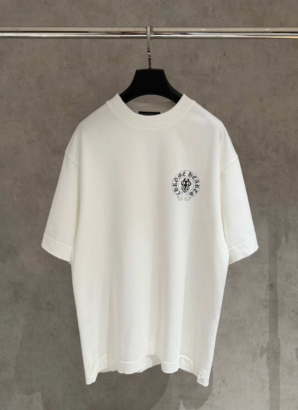 White short-sleeve T-shirt with small circular chest logo