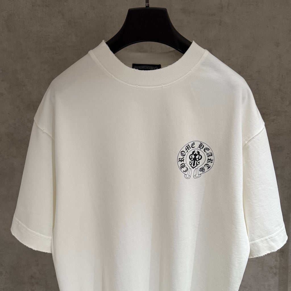 White short-sleeve T-shirt with small circular chest emblem