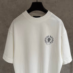 White short-sleeve T-shirt with small circular chest emblem