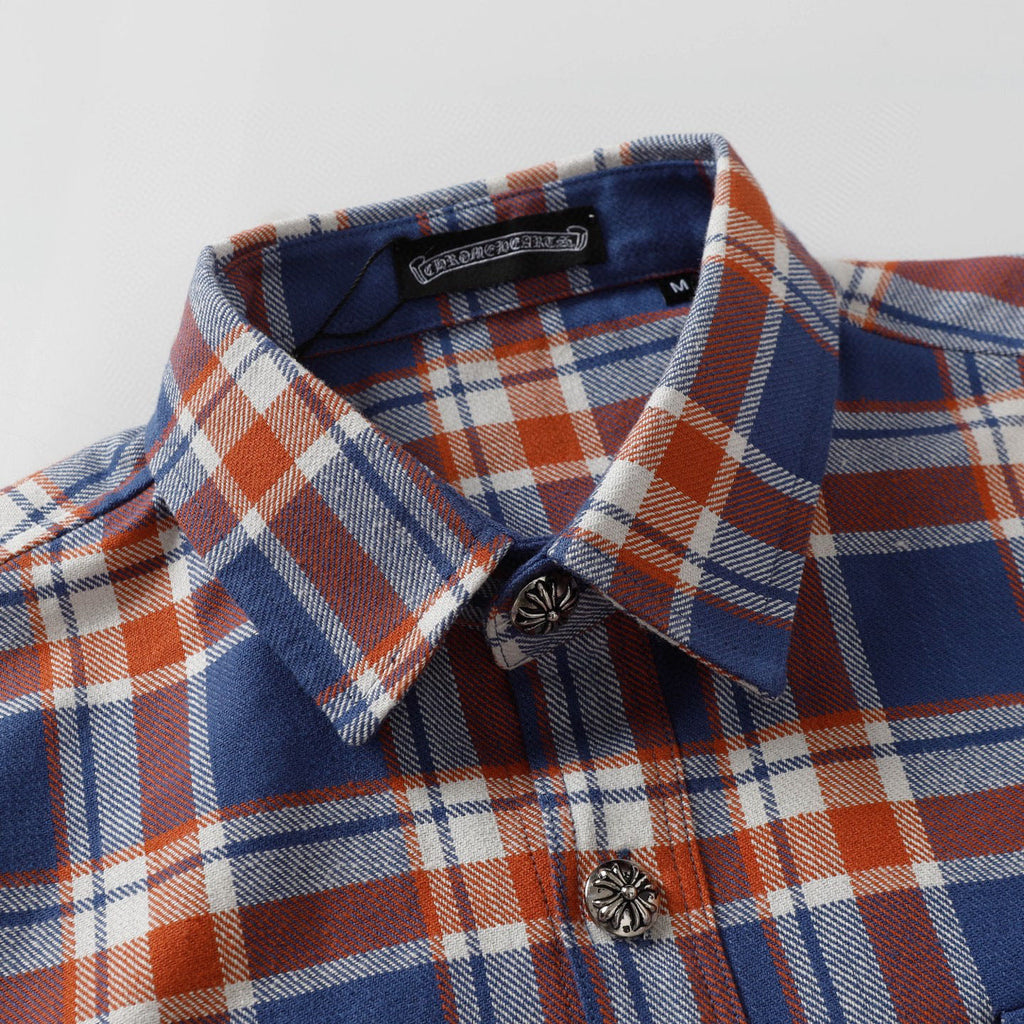 Plaid shirt collar and front with button placket and decorative button detail.