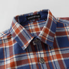 Plaid shirt collar and front with button placket and decorative button detail.