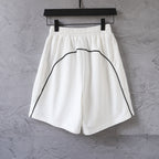 White shorts with elastic waistband and curved side logo print