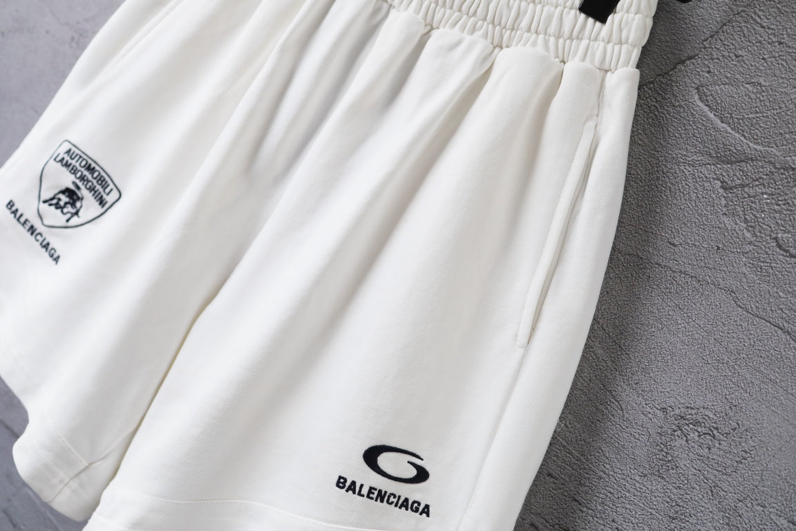 White shorts close-up of gathered waist and small Balenciaga logo at leg