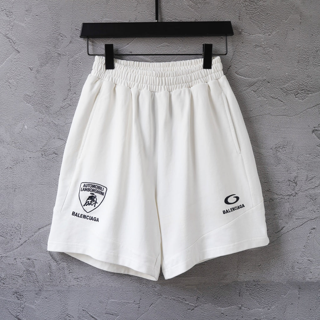 White drawstring shorts with elastic waistband and front Balenciaga logo patch