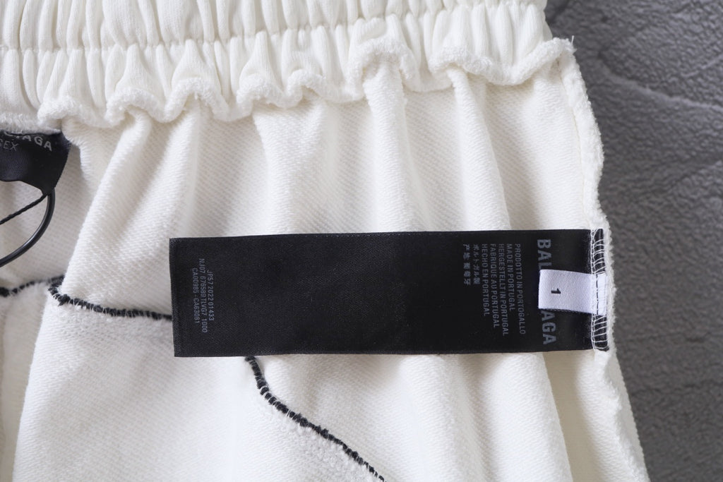 White shorts close-up with black care label tag on the side