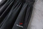 Balenciaga pants, dark gray shorts with embroidered red puma and BALENCIAGA logo