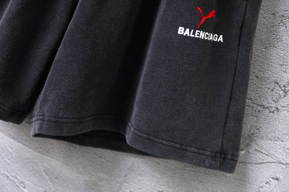 Balenciaga pants, dark gray pleated shorts with curved stitched hem edge