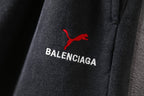 Balenciaga pants, dark gray fabric with red puma icon and BALENCIAGA text