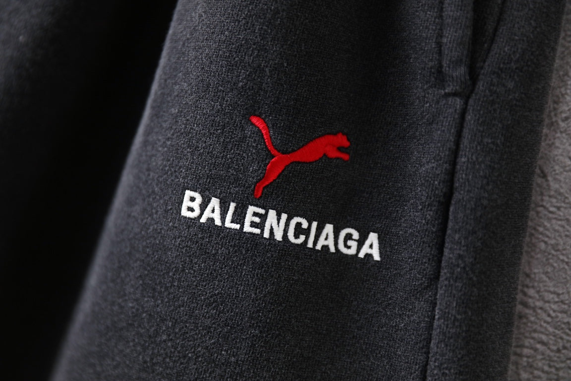 Balenciaga pants, dark gray fabric with red puma icon and BALENCIAGA text