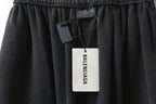 Balenciaga pants, dark gray elastic waist shorts with hanging BALENCIAGA tag