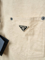 Cream shirt chest pocket with Prada triangle logo patch