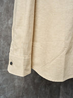 Cream long-sleeve shirt with dark cuff button