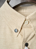 Cream shirt collar and placket with button detail