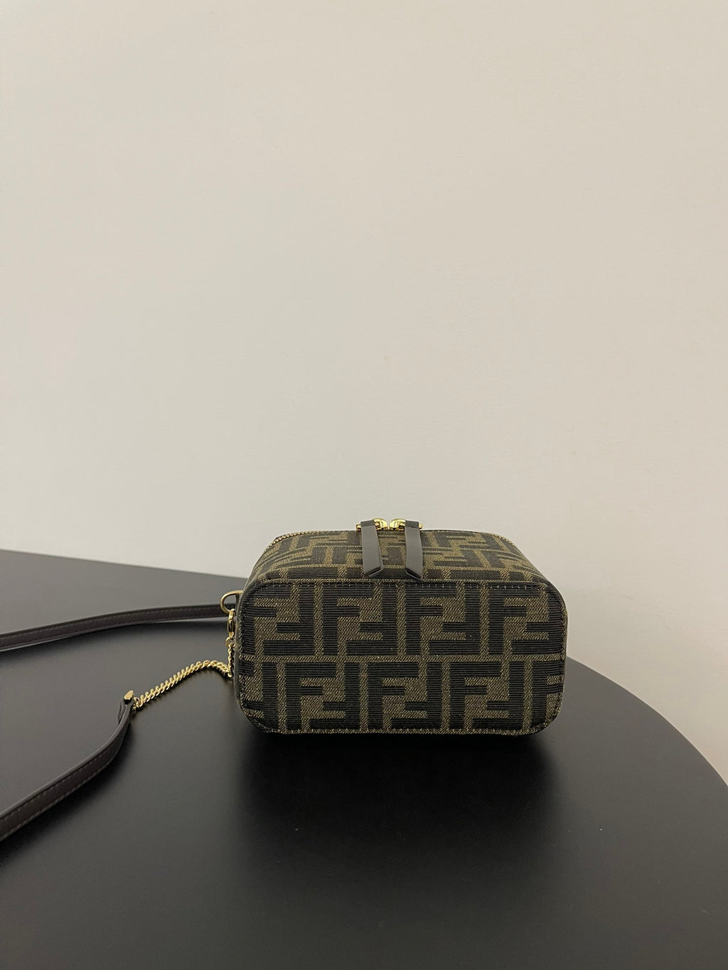 Fendi mini bag top view in brown FF jacquard with gold zipper track and handle