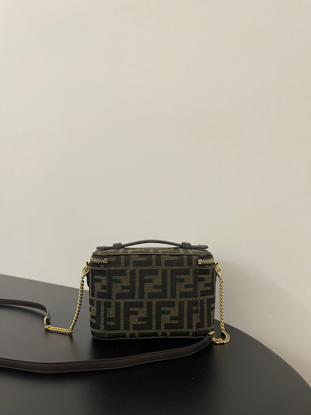 Fendi mini crossbody bag back view in brown FF jacquard with gold chain strap