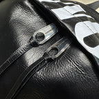 Balenciaga men’s backpack strap attachment with metal rings and small logo patch