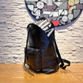 Balenciaga men’s black leather backpack with large white logo graphic on front
