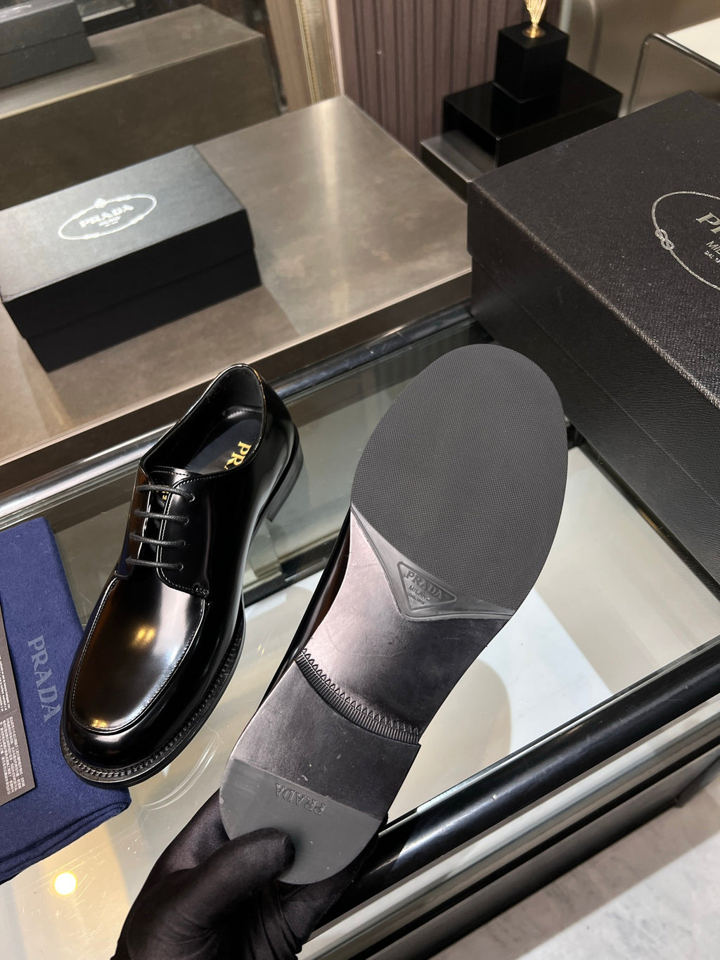 Prada unisex leather lace-up shoes with matching black sole and branded insole