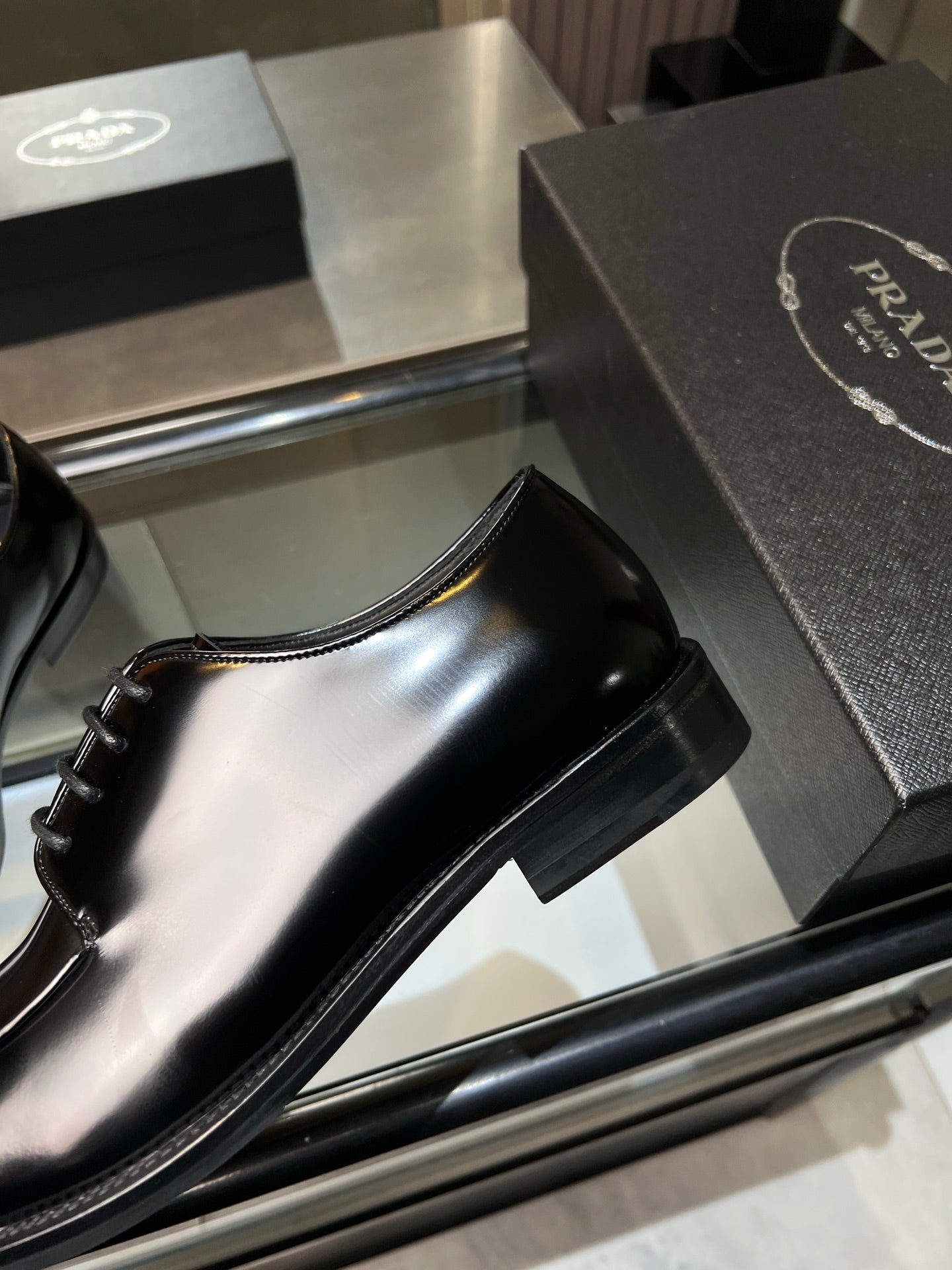 Prada unisex leather lace-up shoe, black glossy finish with low stacked heel