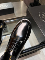 Prada unisex leather lace-up shoe close-up, black upper with lace-up panel stitching