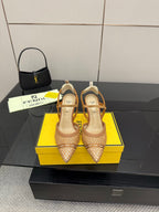 Pointed-toe heeled sandals with woven tan straps and ankle sling, gold heel.
